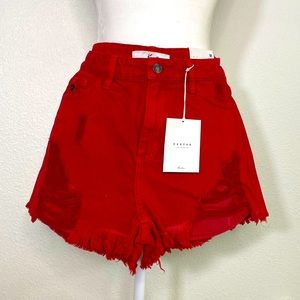 Distressed red denim cut off shorts